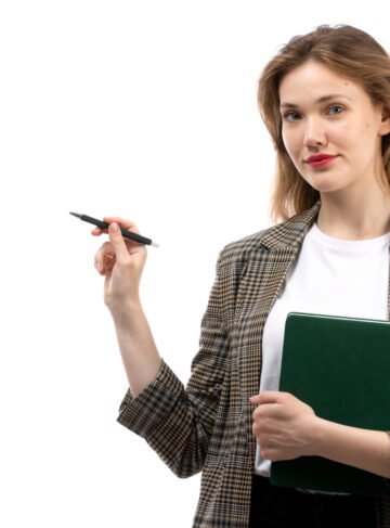 front-view-young-beautiful-lady-white-t-shirt-black-jeans-coat-holding-green-book-pen-smiling-white